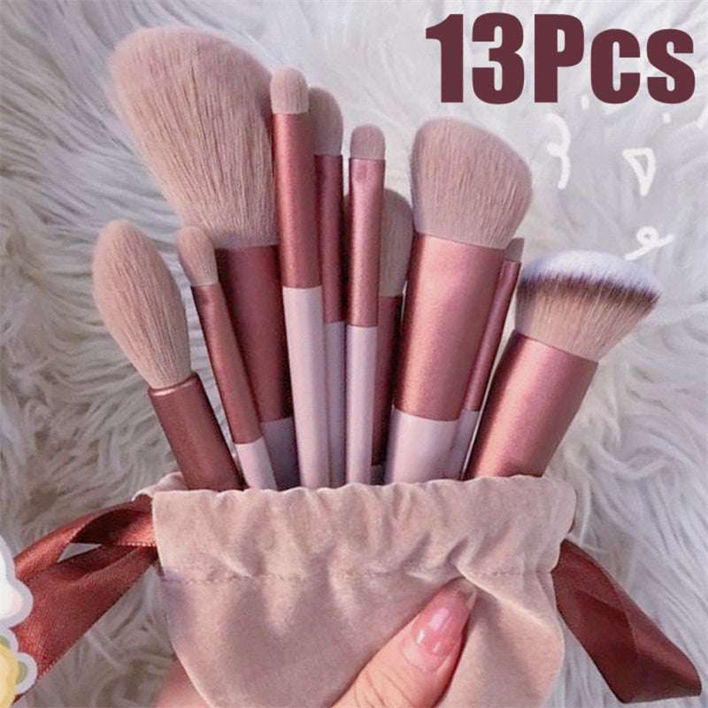 13 makeup brush set with soft pink bristles and rose-gold handles, fanned display