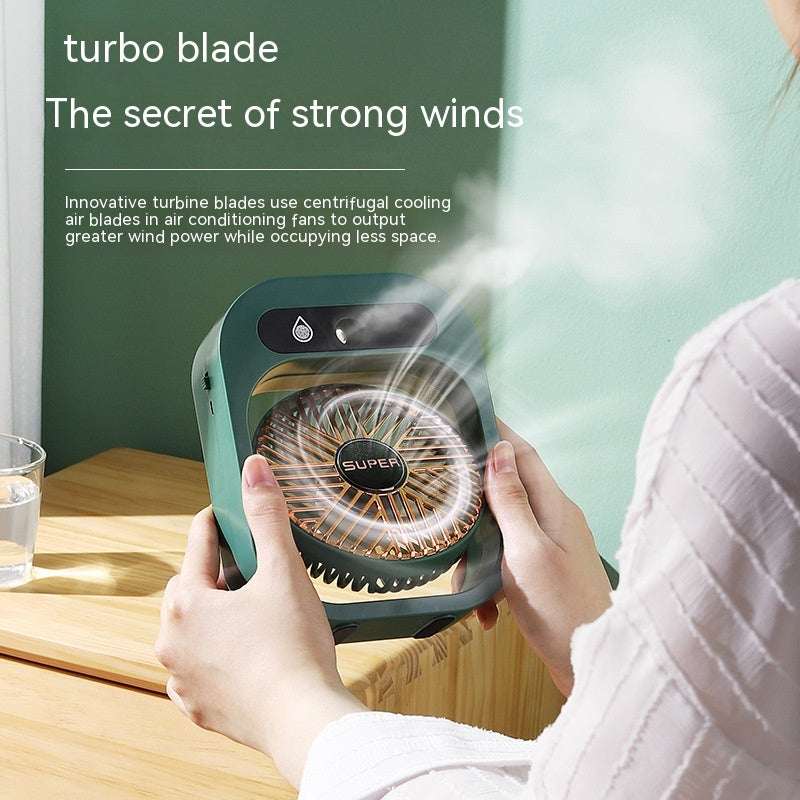 Portable misting air cooler fan, green body held by hands with front grille visible