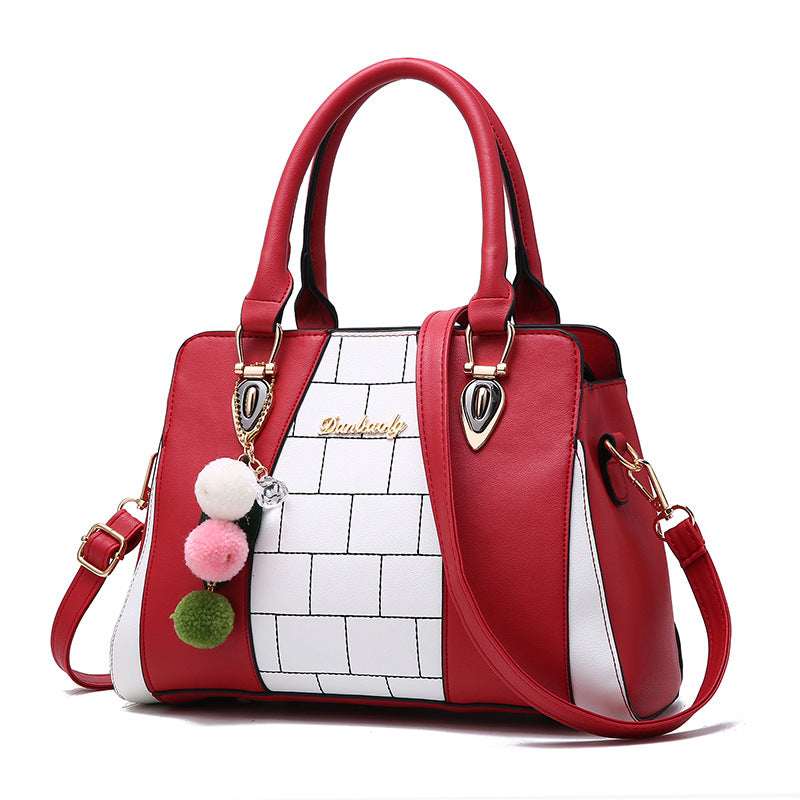 Women’s shoulder handbag with red body, white grid front, top handles, shoulder strap