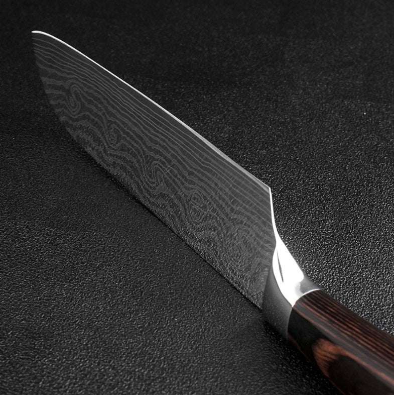 Damascus chef knife blade with dark patterned steel and polished edge