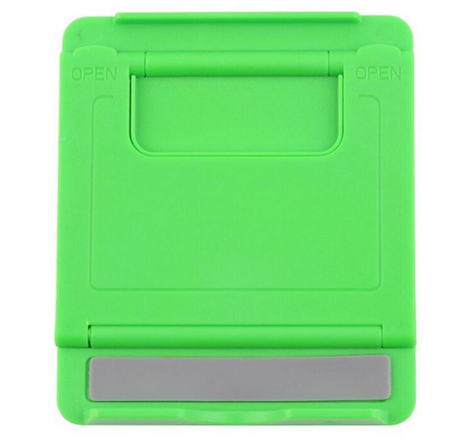 Foldable plastic tablet stand in green with open cradle and support base