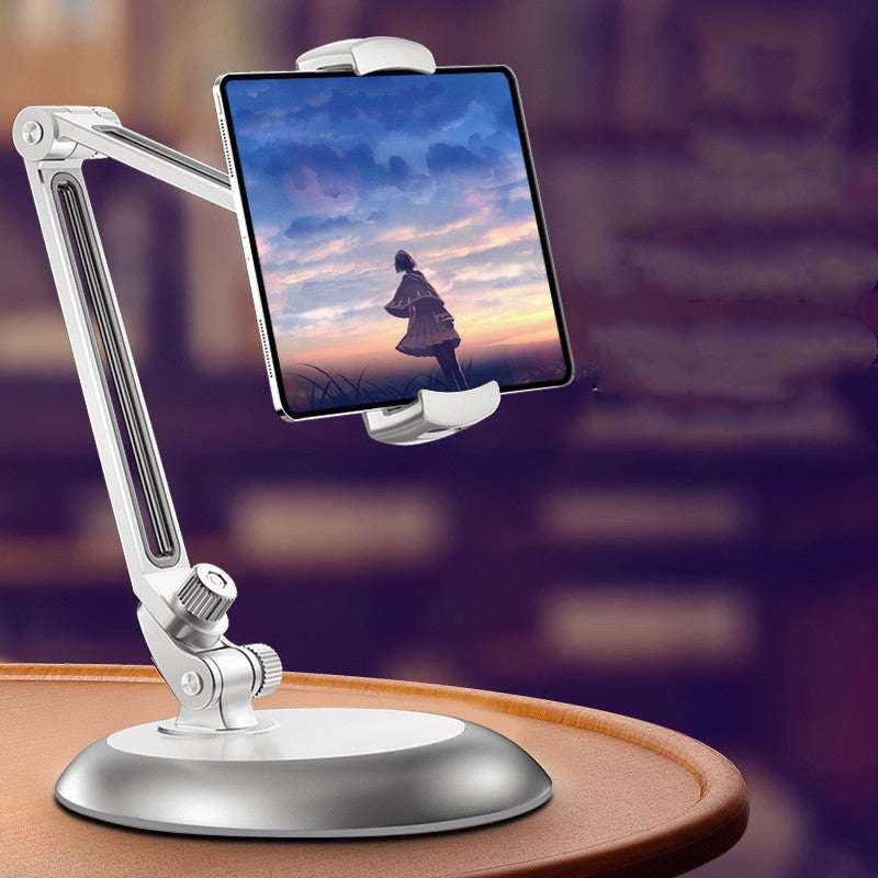 White adjustable phone stand with clamp and round base, holding a tablet in portrait