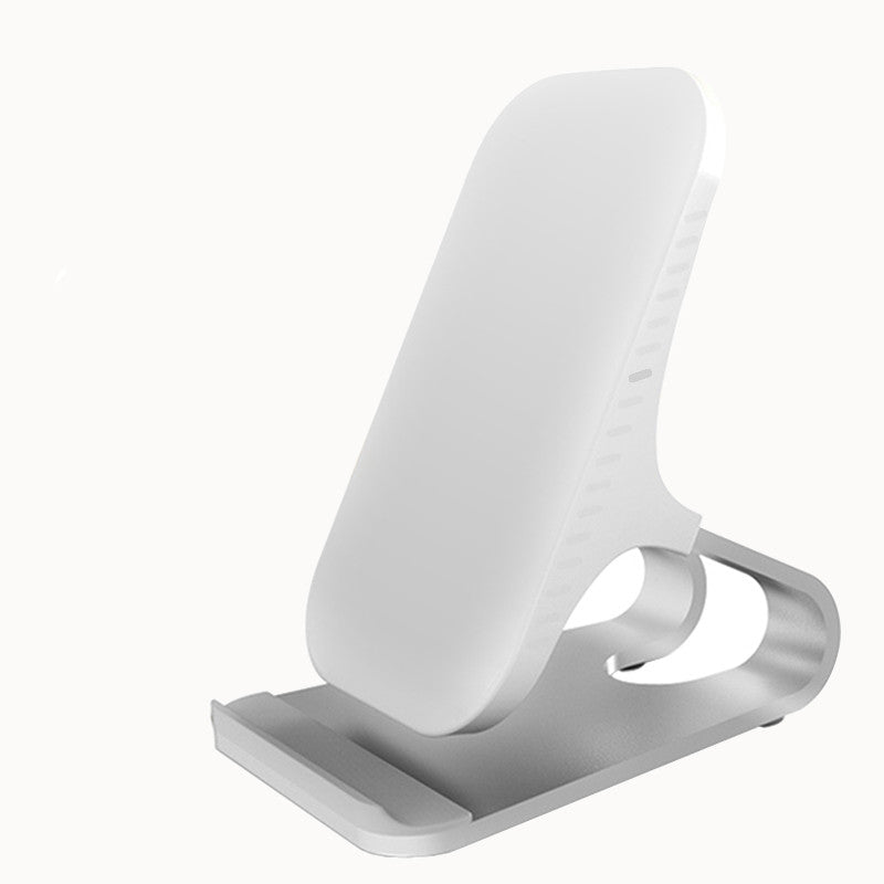 White wireless phone charging stand with angled cradle