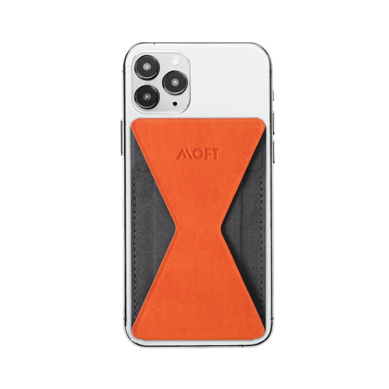 Mobile phone folding stand with orange fabric insert