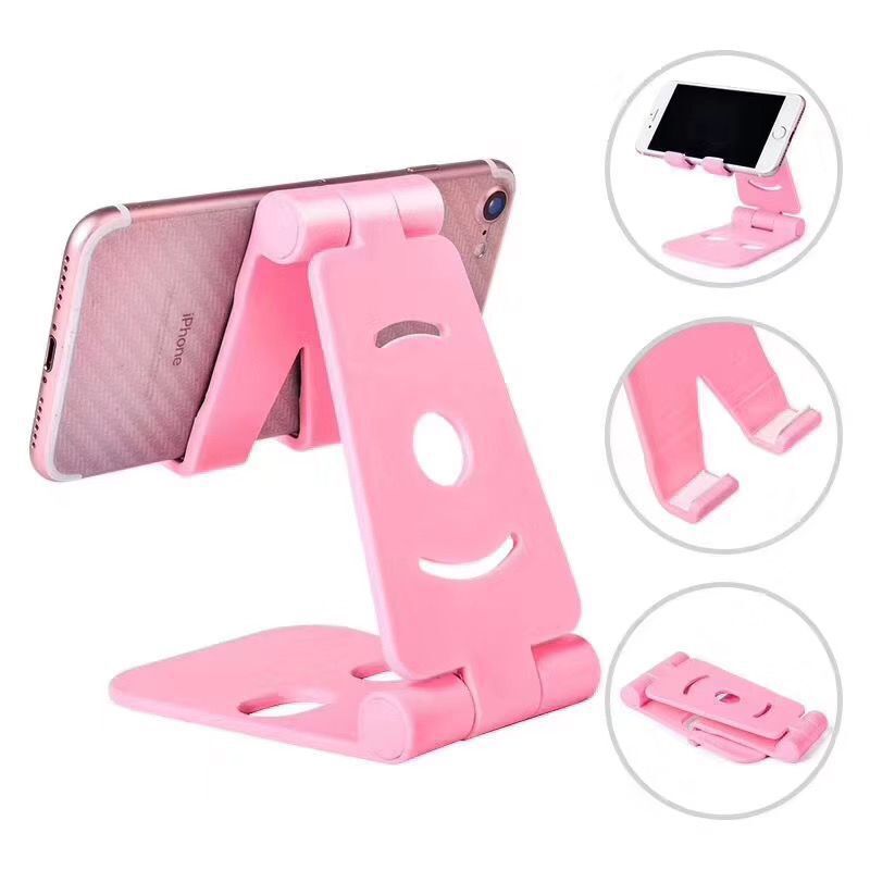 Pink dual-folding phone desktop stand with wide cradle and circular cutout
