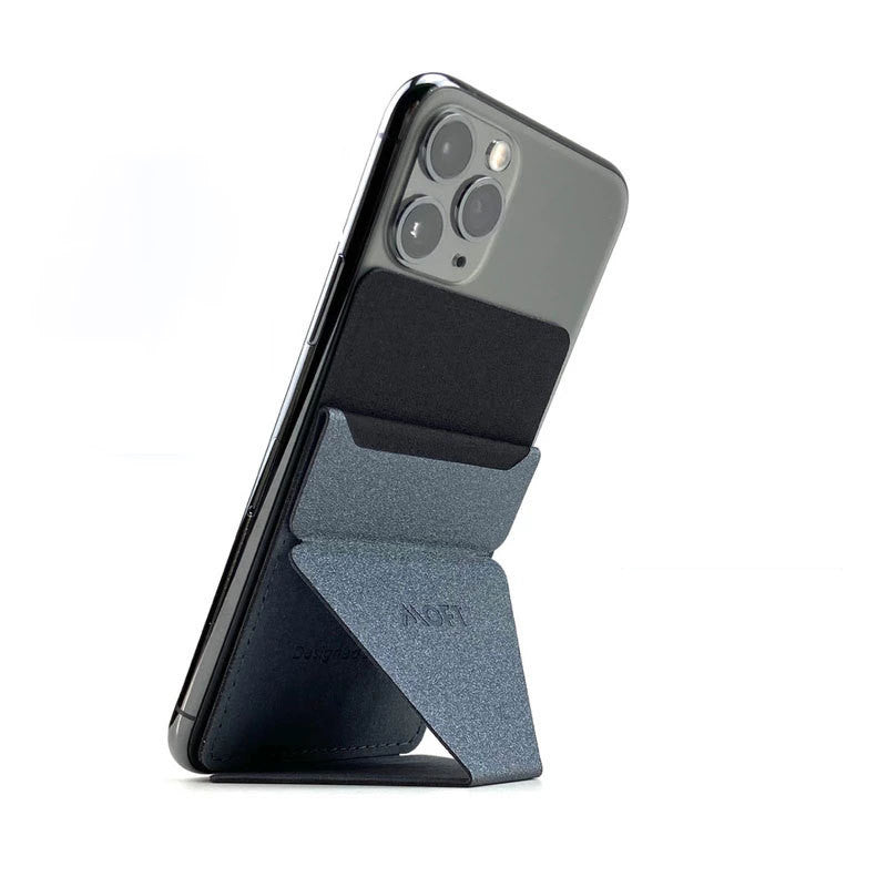 Mobile phone stand with grey fabric wedge, propping a phone in portrait view