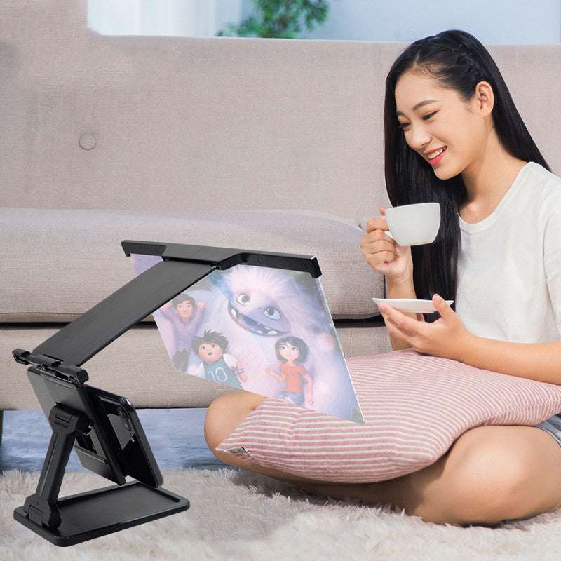 Black folding phone screen amplifier stand with viewing lens panel and adjustable arms