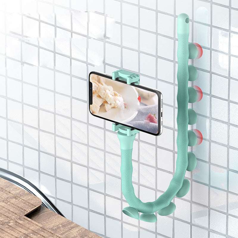 Flexible phone holder with mint green worm stand and suction cups mounted on wall