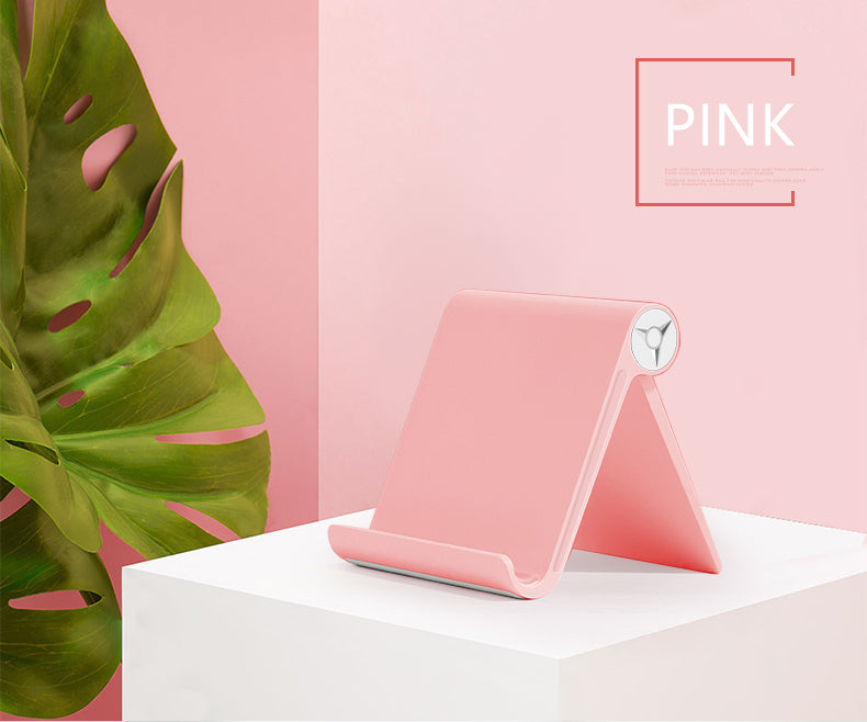 Pink phone and tablet stand with circular swivel hinge for desk viewing