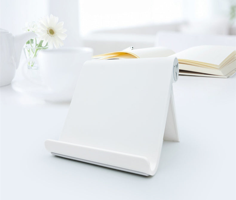 White phone and tablet stand with slanted base and circular hinge