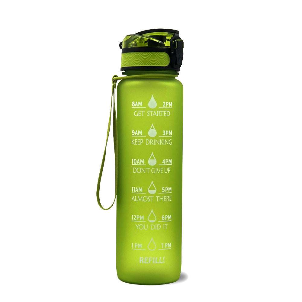 Motivational water bottle with time markers, green body, flip lid, and wrist strap