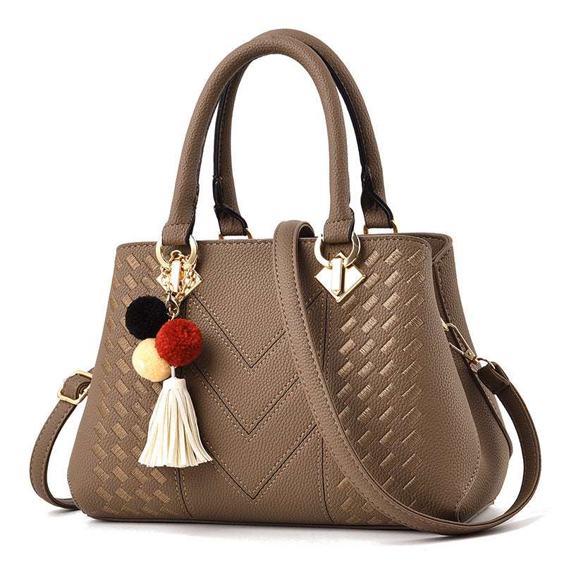 Khaki quilted crossbody handbag with tassel pom and gold-tone hardware