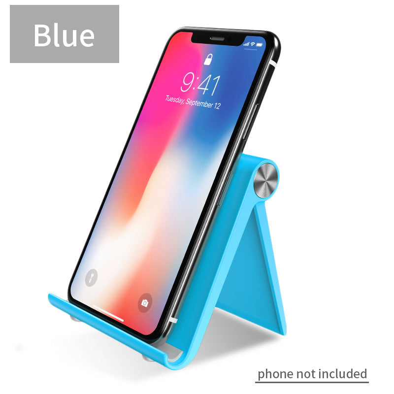 Blue desktop phone stand with angled legs and circular knob, holding a smartphone