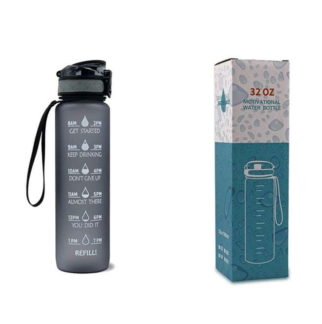 Motivational water bottle with time markers, dark gray bottle and matching box