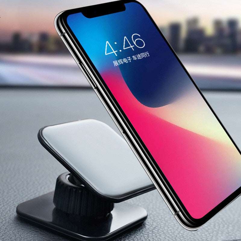 Black rotating mobile phone navigation stand with curved base and cradle
