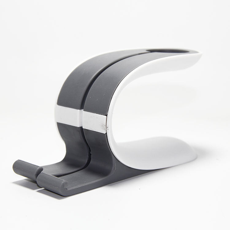 Grey and black charging stand for phone and smartwatch with curved cradle