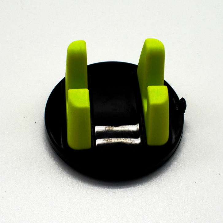 Green dashboard phone mount with two silicone arms on a black suction base
