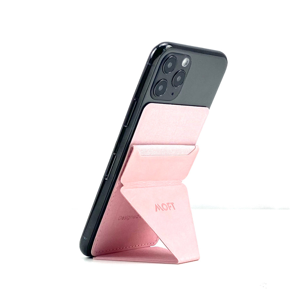 Mobile phone folding stand with pink fabric insert