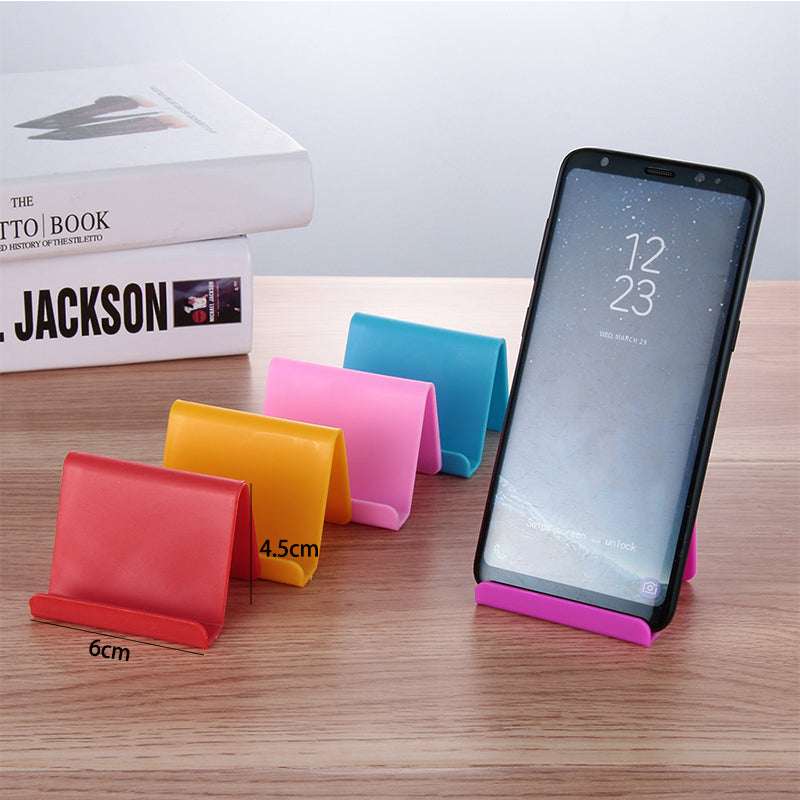 Mobile phone stand with colored base, holding smartphone in portrait view.