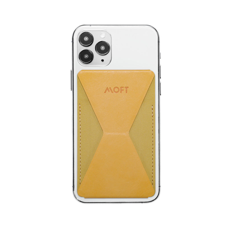 Mobile phone folding stand with mustard yellow triangular insert under case