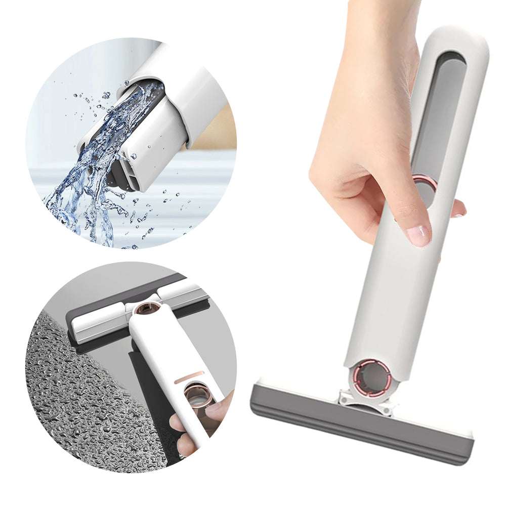 Mini sponge squeeze mop with white handle, gray flat head attached, hand gripping