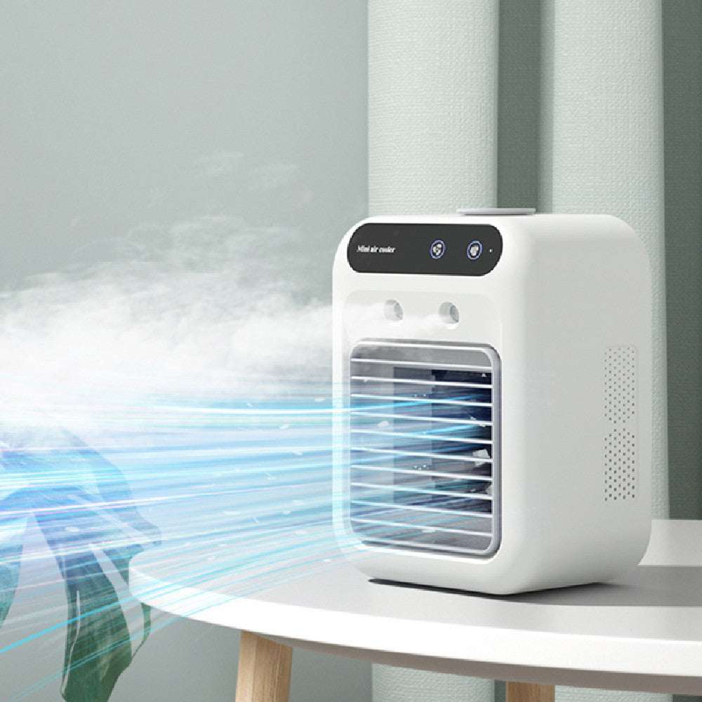 Ivory portable air cooler fan with front grille, mist and cool airflow on tabletop