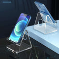 Transparent acrylic mobile phone stand with open cradle, phone propped upright