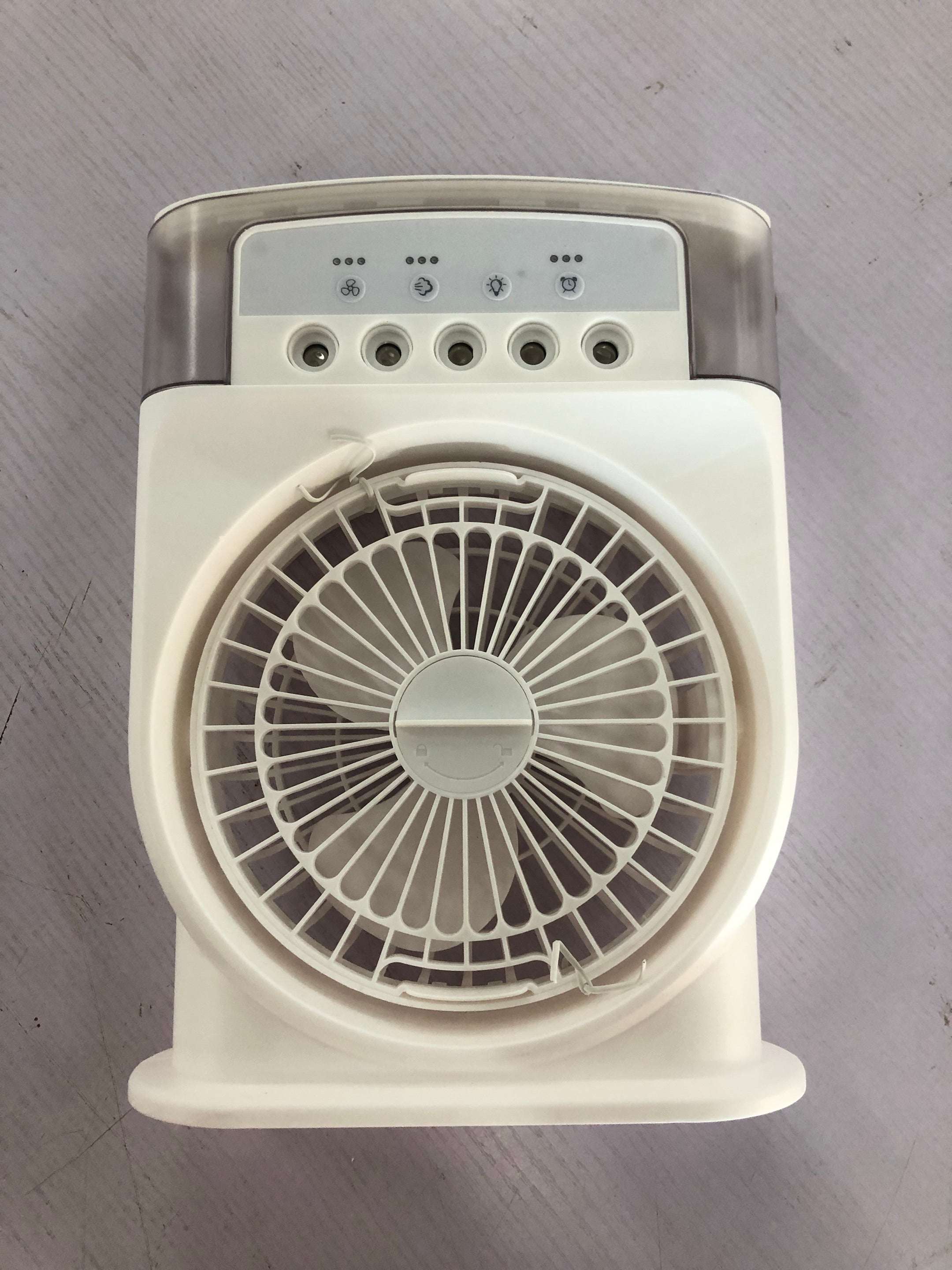Portable USB air conditioner cooling fan in white, close-up of top control panel and grille