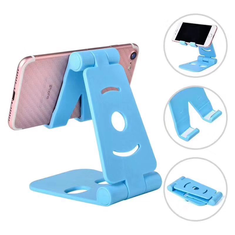 Blue dual-folding phone desktop stand with wide cradle and circular cutout