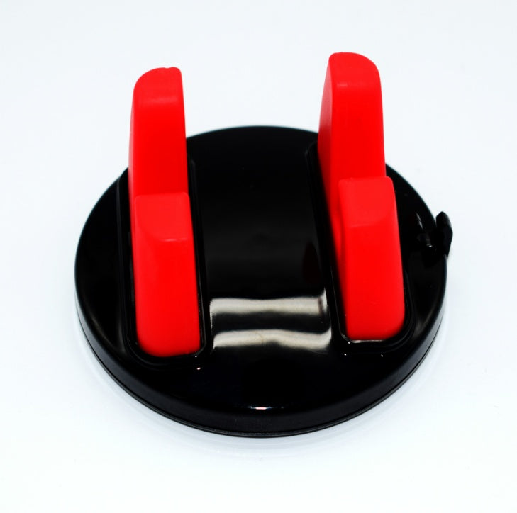 Red dashboard phone mount with two silicone arms on a black suction base