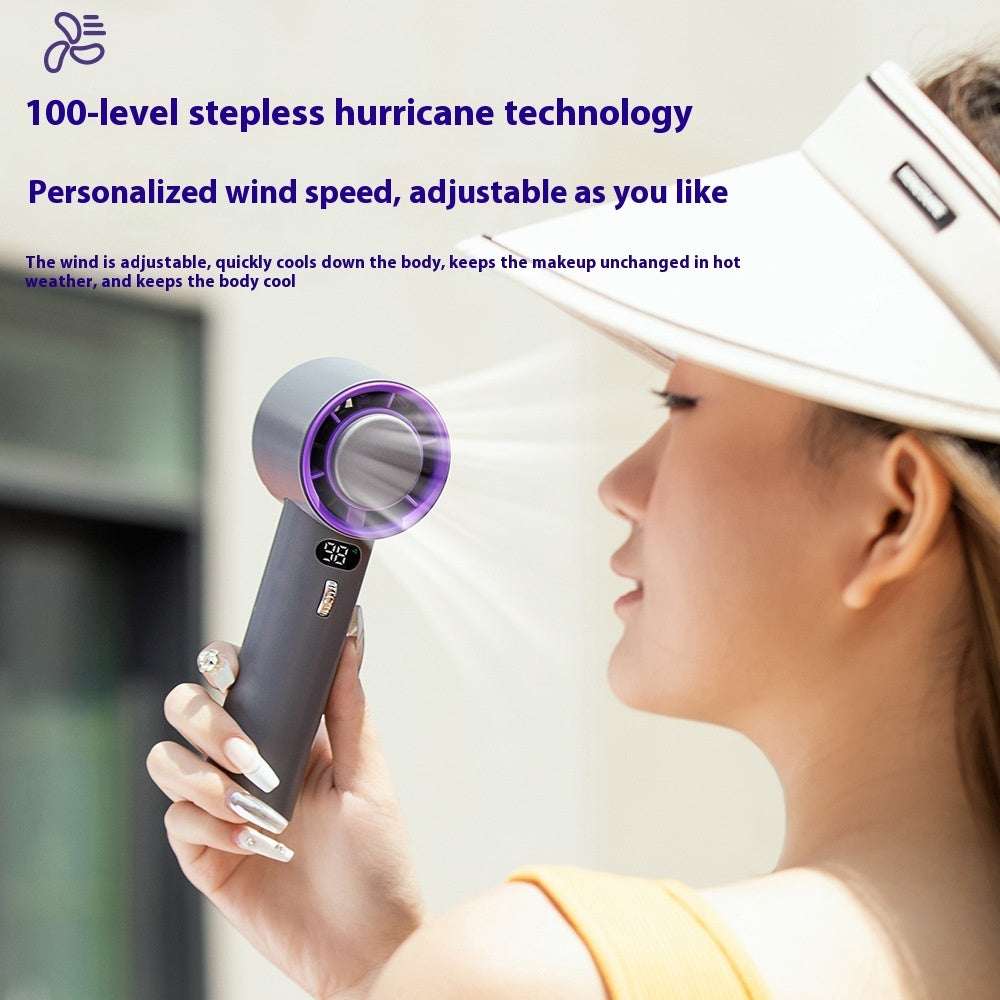 Portable turbo cooling fan aimed at face, purple-ring intake and speed button