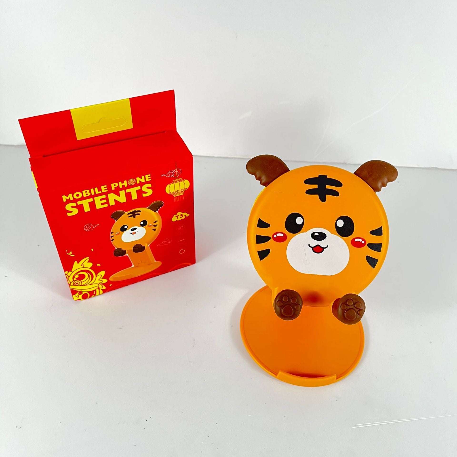 Orange tiger cartoon phone stand with fold-out base and paw grips