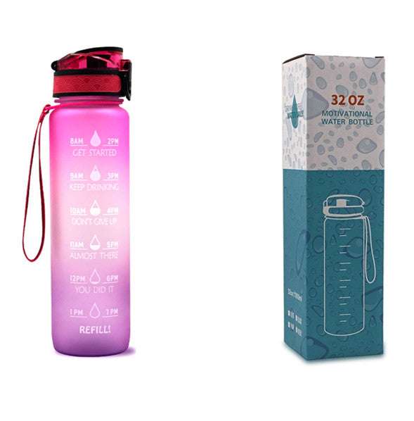 Motivational water bottle with time markers, pink-to-purple bottle and matching box