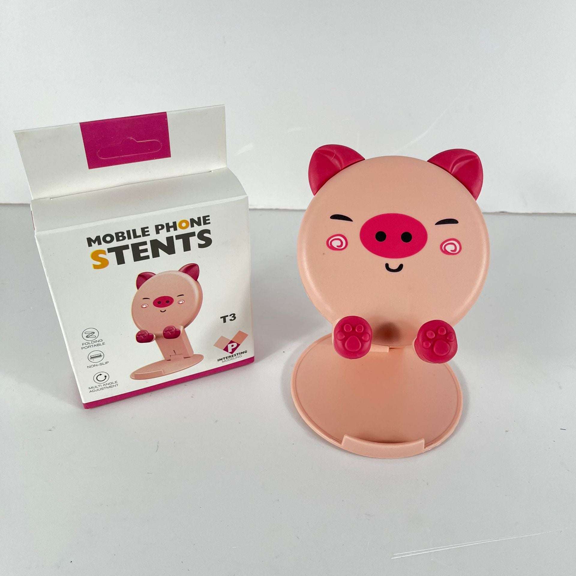 Pink pig cartoon phone stand with fold-out base and paw grips