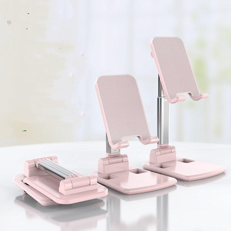 Pink telescopic phone stand with ridged cradle pads and stable wide base platforms