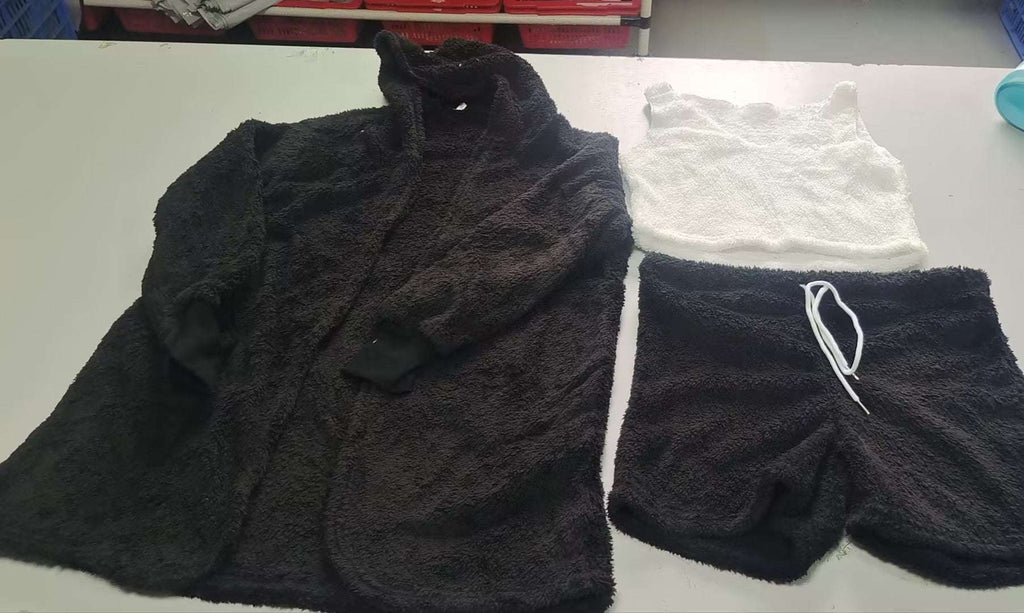 Fuzzy black lounge set with long-sleeve hooded top and drawstring shorts