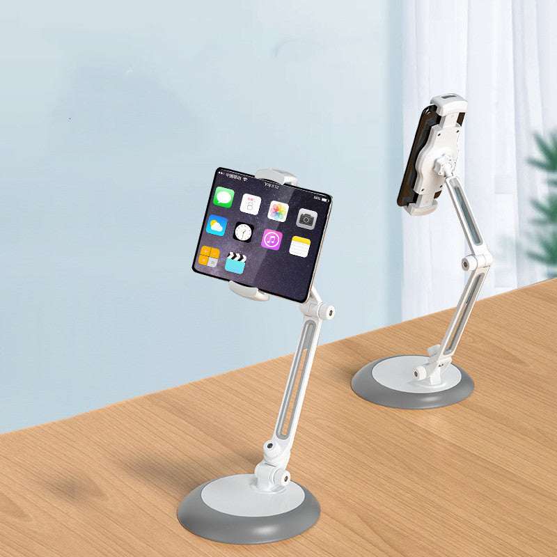 White adjustable phone stand with round base and extended arm, holding a smartphone