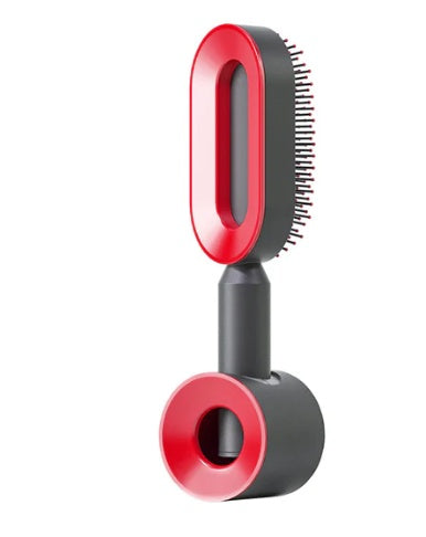 Self-cleaning hair brush with red bristle head, red cleaning base, and black handle