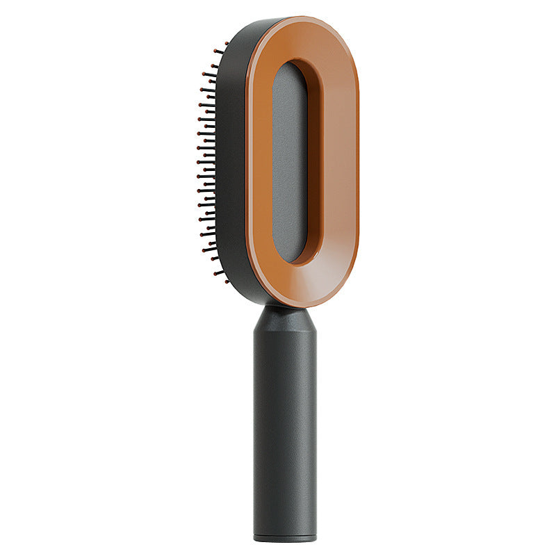 Self-cleaning hair brush with dark bristle pad, brown trim ring, and black handle