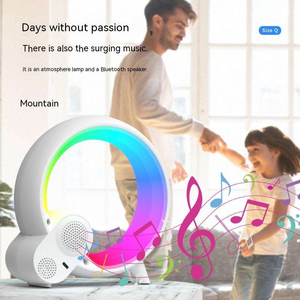 Sunrise alarm clock lamp with multicolor light ring and speaker grille on base