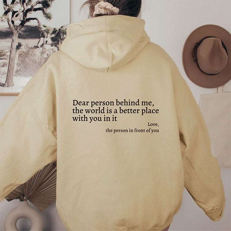 Cream plush hoodie with drawstring hood and kangaroo pocket, letter graphic on back