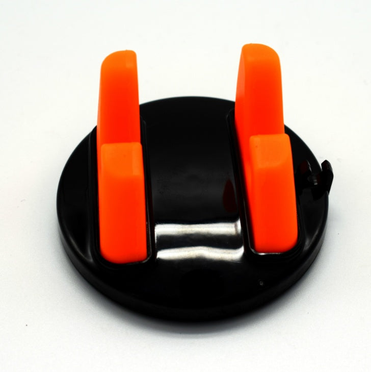 Orange dashboard phone mount with two silicone arms on a black suction base