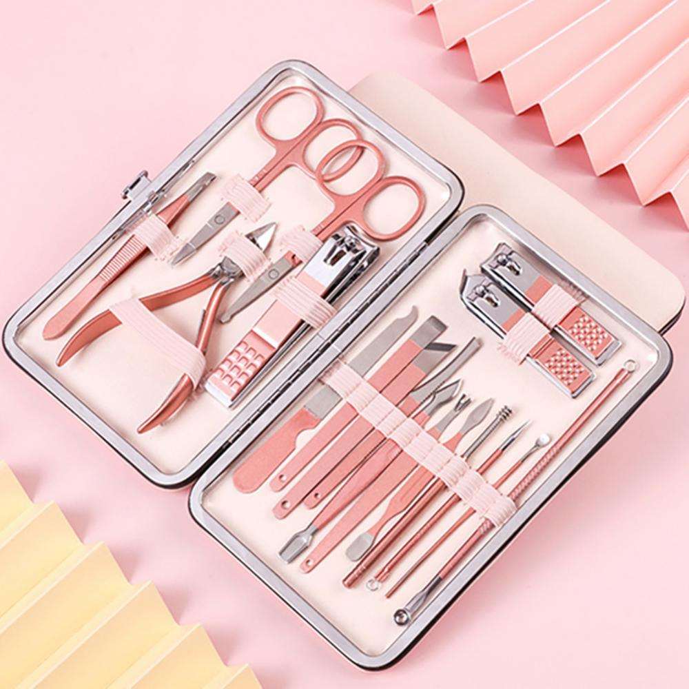 Nail grooming tool set case with pink handles and silver clippers, scissors, and tools