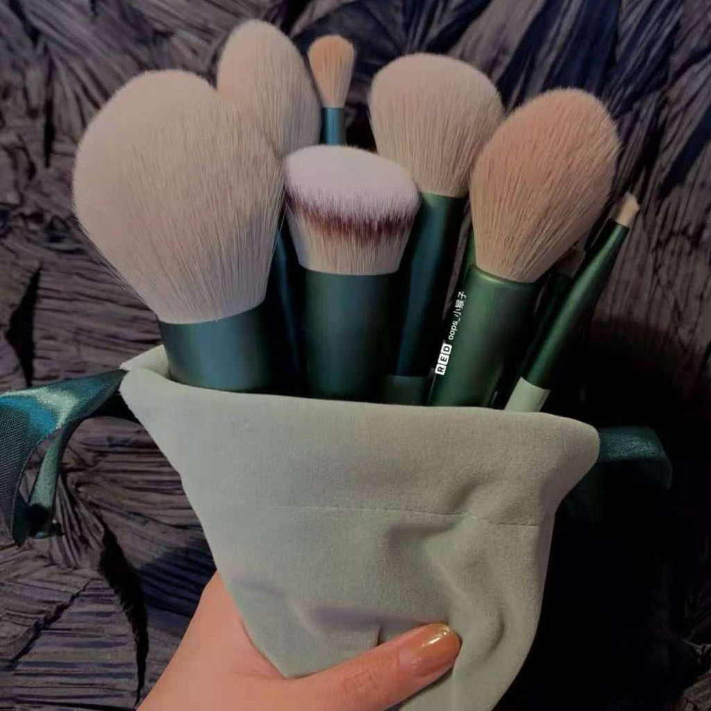 13 makeup brush set in green holders with soft tan bristles, stored in fabric pouch