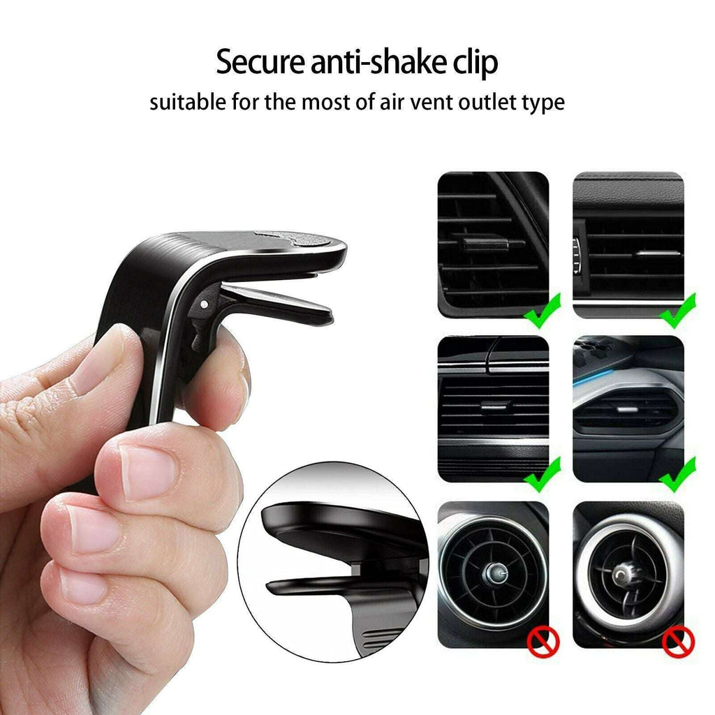 Black phone vent mount anti-shake clip, shown in hand with air vent attachments