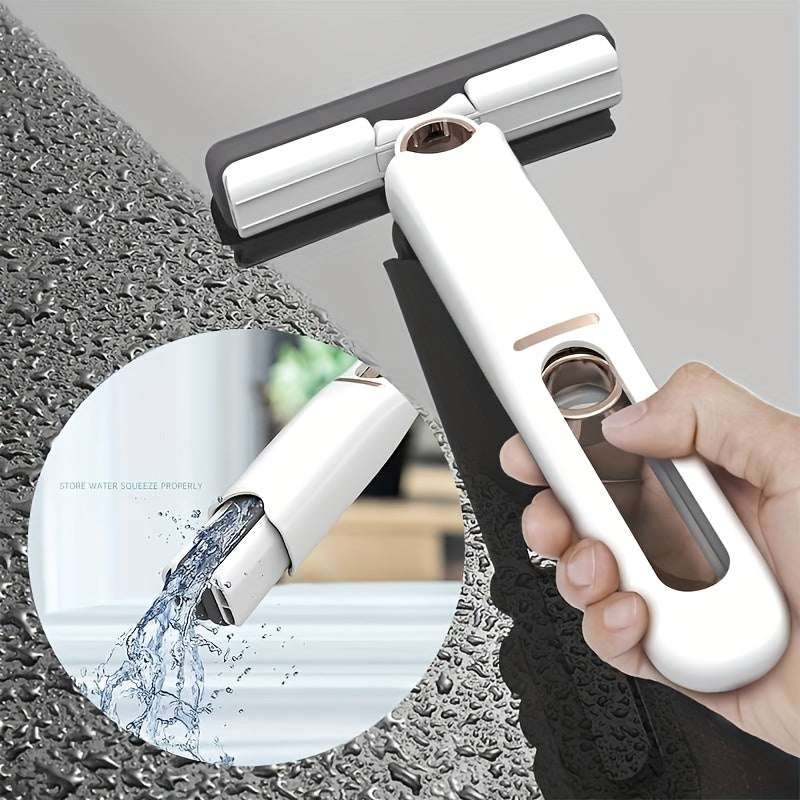 White portable self-squeeze mini mop with rectangular head, water droplets splashing near floor