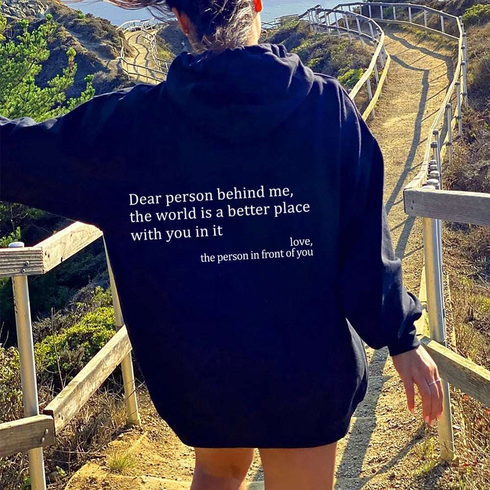 Navy plush hoodie with drawstring hood, kangaroo pocket, and letter print on back