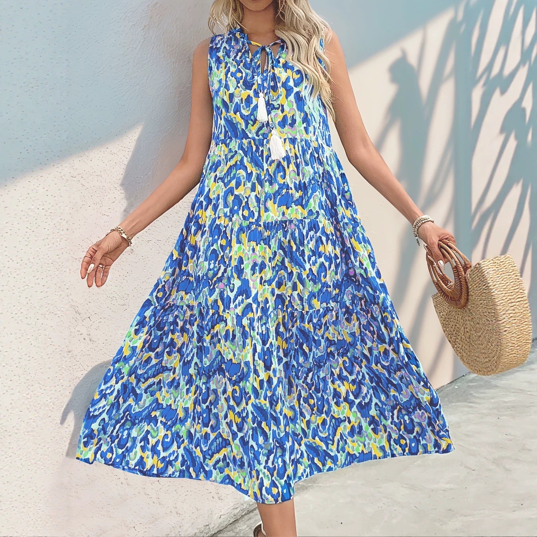 Sleeveless V-neck tassel abstract-print dress, blue and yellow tiered midi skirt