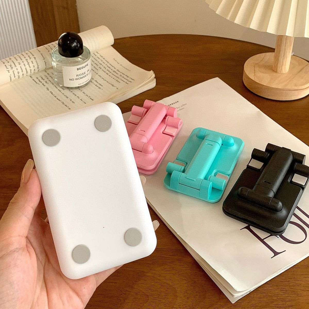 Folding mobile phone stand backplate, white with three circular grip dots