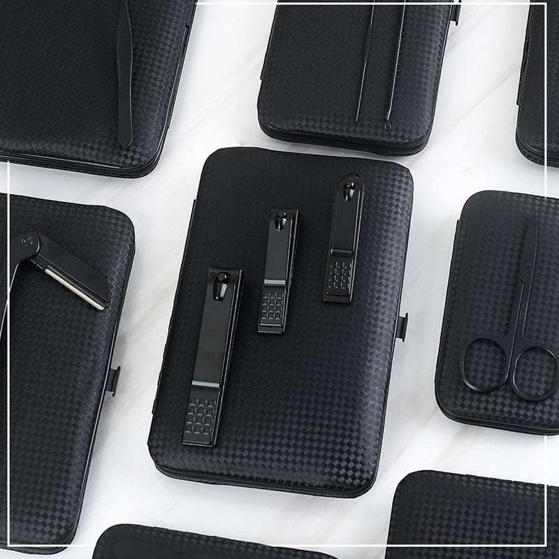 Black nail grooming tool set case with clippers, tweezers, and nail files